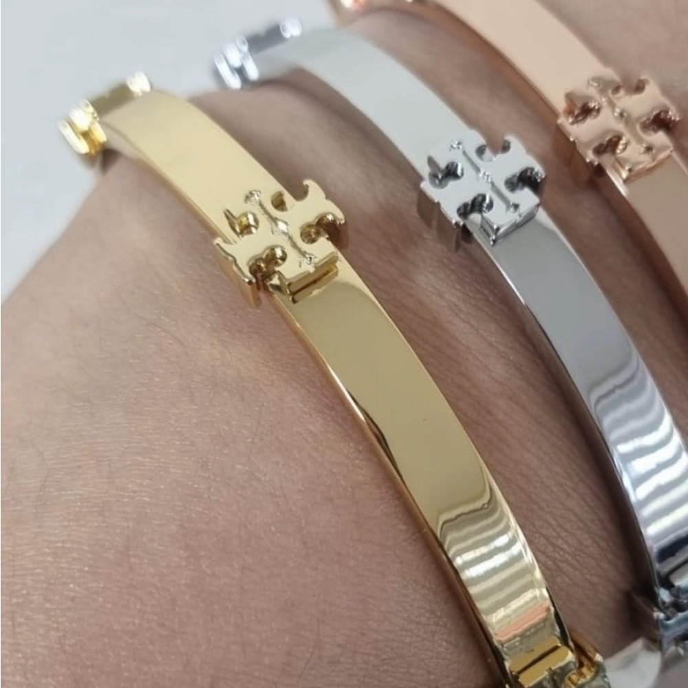 Tory Burch Gold logo Bracelets, pre loved and ready for a new posher!